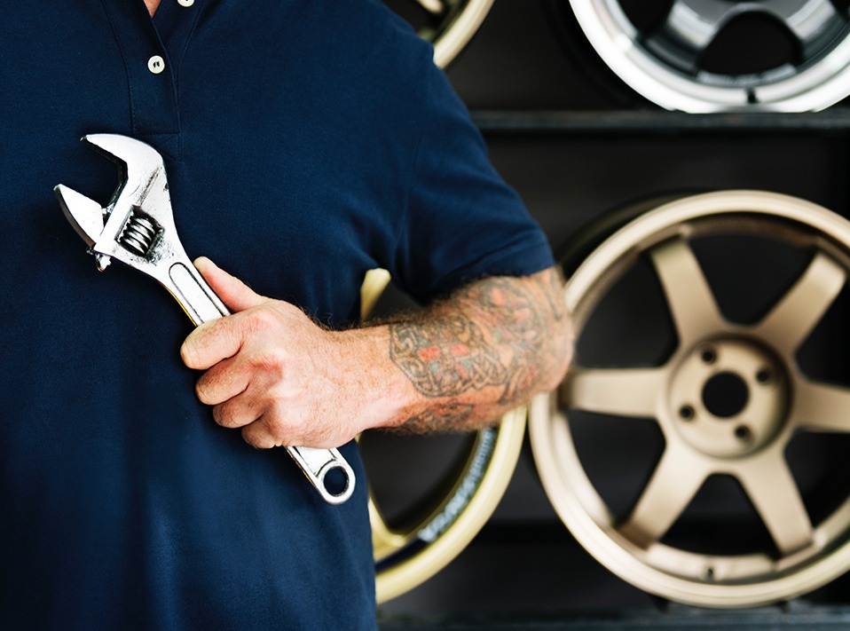 Mechanic holding a spanner - Car Repairs London Borough of Hackney