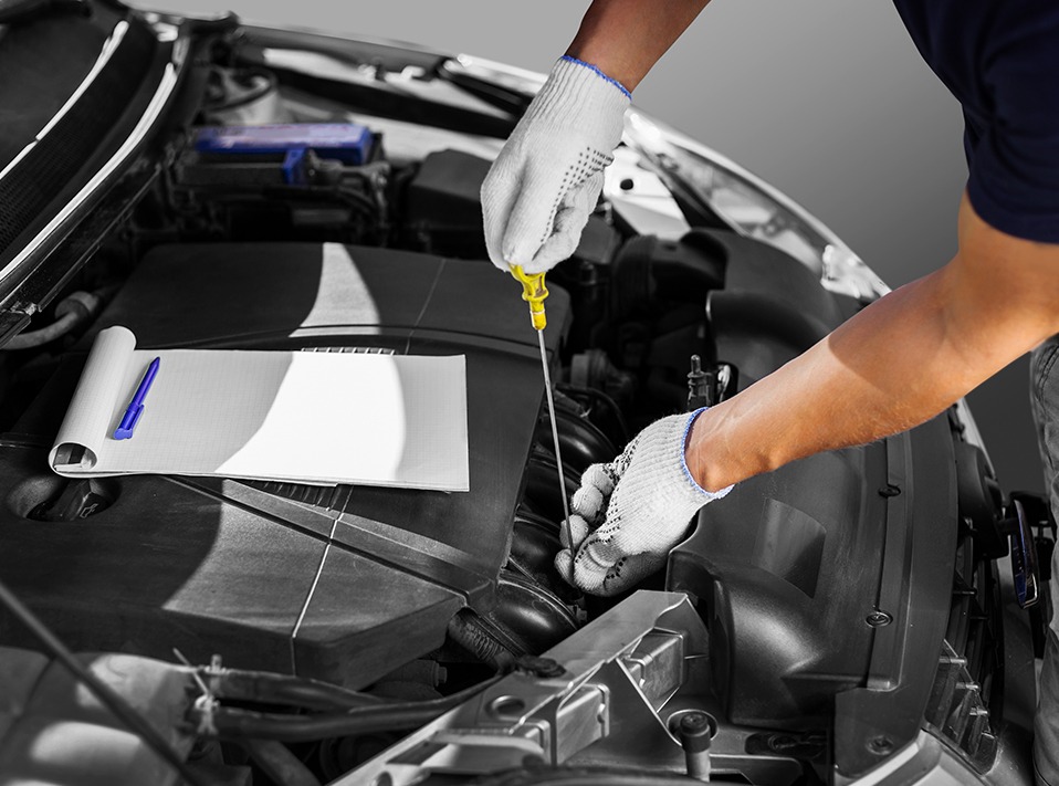 Mechanic checking over a vehicle for its service - Car Servicing London Borough of Hackney